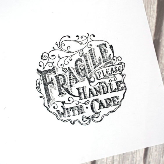 This "Fragile Please Handle With Care" stamp features an intricate vintage-inspired design.